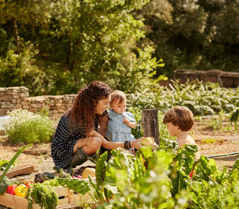 mother and children in garden