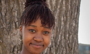 Headshot of Siviwe Dlamini in front of tree